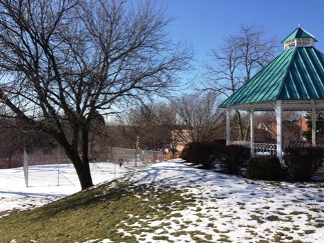 Bon Air Parklet - pavilion in the foreground with a tennis court/dek hockey in the snow-covered fenced-in area